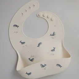 Bavoir à poche en silicone Baleine