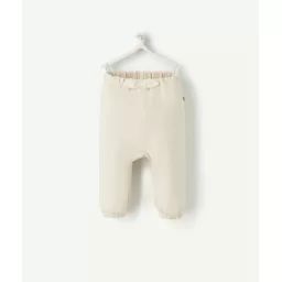 Le pantalon de jogging écru avec pois couleur dorée –  – Soldes