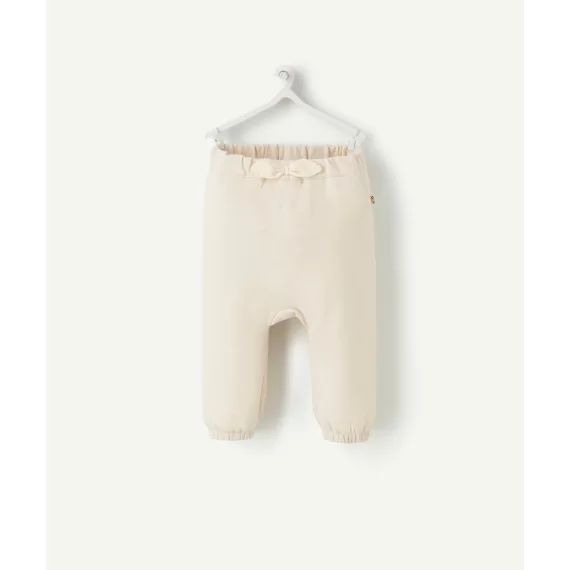 Le pantalon de jogging écru avec pois couleur dorée –  – Soldes