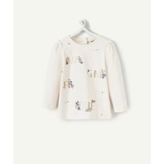 Le t-shirt rose pâle avec message pailleté en coton biologique