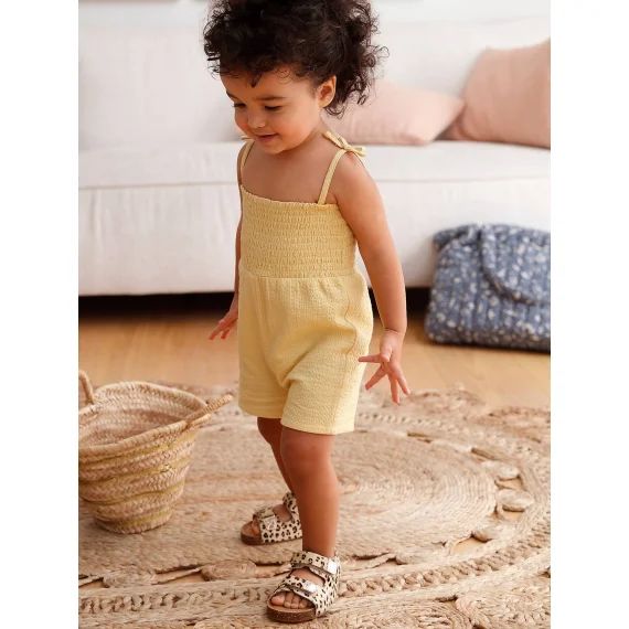 Combinaison smockée bébé à bretelles jaune pâle