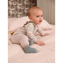 Salopette en tricot bébé bretelles à volants beige chiné