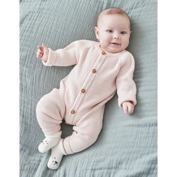 Combinaison en tricot rose
